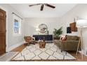 Comfortable living room featuring a ceiling fan and lots of seating at 2318 S Lincoln St, Denver, CO 80210