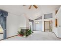 Open living room with bright interior design and a cozy fireplace at 2132 S Scranton Way, Aurora, CO 80014
