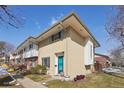 Attractive brick townhouse showcasing a unique architectural design and colorful turquoise door at 12531 W Alameda Dr, Lakewood, CO 80228