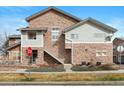 Charming townhouse featuring stone accents, hardiplank siding, and a private entrance at 18661 E Water Dr # F, Aurora, CO 80013