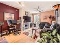 Cozy living room with fireplace, modern furniture and a balcony entrance at 9079 E Panorama Cir # 309, Englewood, CO 80112