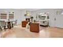 Bright, open living space with hardwood floors, modern furniture, and natural light at 6620 S Foresthill St, Littleton, CO 80120