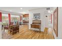 Bright, open-concept living room and dining area with hardwood floors at 1200 N Humboldt St # 101, Denver, CO 80218