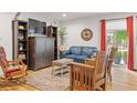 Cozy living room featuring hardwood floors, comfortable seating, and ample natural light at 1200 N Humboldt St # 101, Denver, CO 80218