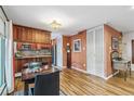 Open living space with warm wood floors, storage closets, eat-in area, and lots of natural light at 1200 N Humboldt St # 101, Denver, CO 80218