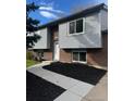 Well maintained exterior with newer siding and brick facade at 10630 Routt Way, Broomfield, CO 80021