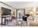 Cozy living room with natural light and comfortable seating arrangement at 2375 S Linden Ct # 118, Denver, CO 80222