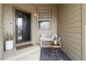 Cozy front porch featuring bench seating, decorative rug, and stylish decor at 2333 Paint Pony Cir, Castle Rock, CO 80108
