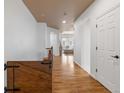 Inviting hallway with hardwood floors and neutral paint palette at 2333 Paint Pony Cir, Castle Rock, CO 80108
