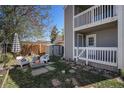 Charming backyard featuring a fire pit, seating, and a fenced yard, ideal for relaxation at 1403 Valentia St, Denver, CO 80220