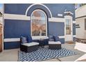 Cozy porch featuring comfortable seating, a stylish outdoor rug, and a charming curb appeal at 1144 S Logan St, Denver, CO 80210