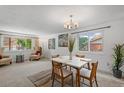 Cozy dining room with a view of the outdoors and comfortable seating for four at 7507 Braun St, Arvada, CO 80005
