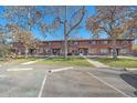 Charming brick townhouse complex with mature trees and well-maintained landscaping at 3744 Miller Ct, Wheat Ridge, CO 80033