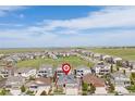 Aerial view of a neighborhood featuring single-Gathering homes and green space in a suburban community at 8234 S Vandriver Way, Aurora, CO 80016