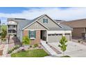 Beautiful single-Gathering home with a three-car garage and landscaped front yard at 8234 S Vandriver Way, Aurora, CO 80016