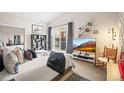 Cozy bedroom with a large window, comfortable bed, and stylish decor at 30 Garfield St # B, Denver, CO 80206