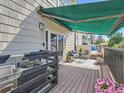 Inviting outdoor patio with an awning and comfortable seating, perfect for relaxation at 30 Garfield St # B, Denver, CO 80206