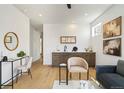 Wet bar with wood cabinets and a sleek countertop at 4490 W 45Th Ave, Denver, CO 80212