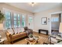 Bright living room features lots of natural light, cozy decor, and hardwood flooring at 1818 S Humboldt St, Denver, CO 80210