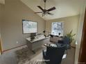 Bright home office with neutral walls, vaulted ceiling, ceiling fan, and large window for plenty of natural light at 7909 Fairfax Ct, Niwot, CO 80503