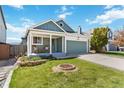 Charming single-Gathering home with a well-manicured lawn and inviting front porch at 7647 Elmwood St, Littleton, CO 80125