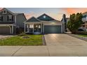 Charming single-Gathering home with a well-manicured lawn and inviting front porch at 7647 Elmwood St, Littleton, CO 80125