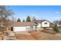 Charming home featuring a well-maintained front yard, attached garage, and neutral exterior paint at 13131 Mercury Dr, Lone Tree, CO 80124