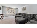 Spacious living room featuring a large sectional sofa, plush carpeting, and a bright window at 4693 Chatham St, Boulder, CO 80301