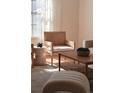 Sunlit living room featuring modern furniture, decorative accessories, and a serene atmosphere at 2301 E Fremont Ave # W03, Centennial, CO 80122