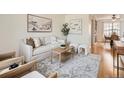 Inviting living room featuring neutral decor, comfortable seating, and an open layout at 2301 E Fremont Ave # W03, Centennial, CO 80122