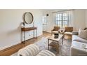 Stylish living room featuring modern furniture, hardwood floors, and plenty of natural light at 2301 E Fremont Ave # W03, Centennial, CO 80122