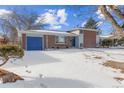 Brick home with attached garage and snowy landscape at 12352 E 30Th Ave, Aurora, CO 80011