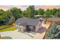 Aerial view of a charming single-Gathering home with well-maintained landscaping and a long driveway at 4645 E Florida Ave, Denver, CO 80222