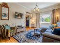 Comfortable living room with a plush sofa, patterned rug, and lots of natural light at 433 Fox St, Denver, CO 80204