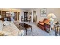 Cozy living room featuring neutral carpeting and furnishings, creating an inviting atmosphere at 170 S Fenton St, Lakewood, CO 80226