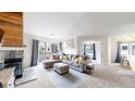Cozy living room with vaulted ceiling, comfortable seating, and access to the outside at 3600 S Pierce St # 5-202, Denver, CO 80235