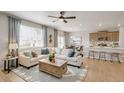 Inviting living room featuring stylish decor and an open floor plan with lots of light at 3285 Belleville Ridge Rd, Elizabeth, CO 80107