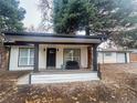 Charming home with a welcoming front porch and mature trees in the yard at 8950 W 26Th, Lakewood, CO 80215