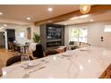 Open-concept kitchen flowing into the living room with marble counter seating at 8950 W 26Th, Lakewood, CO 80215