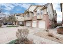 Two-story townhouse featuring a private balcony and two-car garage; set in well-maintained community at 341 Granby Way # A, Aurora, CO 80011