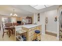 Open living space with dining area, kitchen, and bright natural light at 13631 E Marina Dr # 502, Aurora, CO 80014