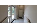 Bright entryway with neutral walls leads to a secure door, featuring modern design elements and durable flooring at 615 24Th St # 103, Golden, CO 80401