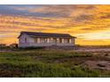 Cozy home with a picturesque sunset backdrop at 69101 E 72Nd Ave, Byers, CO 80103