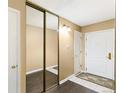 Inviting entryway with tile flooring and a mirrored closet, offering style and functionality at 1020 15Th St # 16A, Denver, CO 80202