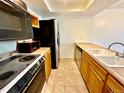 Efficient kitchen layout with appliances and ample countertop space for meal preparation at 16001 E Alaska Pl # 7, Aurora, CO 80017