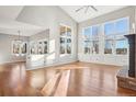 Open living space with hardwood floors, fireplace, and abundant natural light at 18950 E Geddes Ave, Centennial, CO 80016