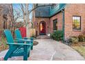 Close up of a charming brick home featuring a stone walkway, a cozy front yard, and a welcoming entrance at 357 Birch St, Denver, CO 80220