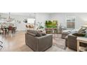Bright, open living room showcases a modern aesthetic with neutral tones and comfortable seating arrangements at 6420 W 6Th Ave, Lakewood, CO 80214