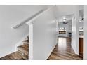 Bright hallway with wood floors leading to the living area at 9126 Gale Blvd # 2, Thornton, CO 80260