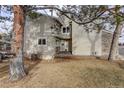 Charming home exterior with stone accents, wood siding, and a cozy front porch at 4605 S Yosemite St # 39, Denver, CO 80237